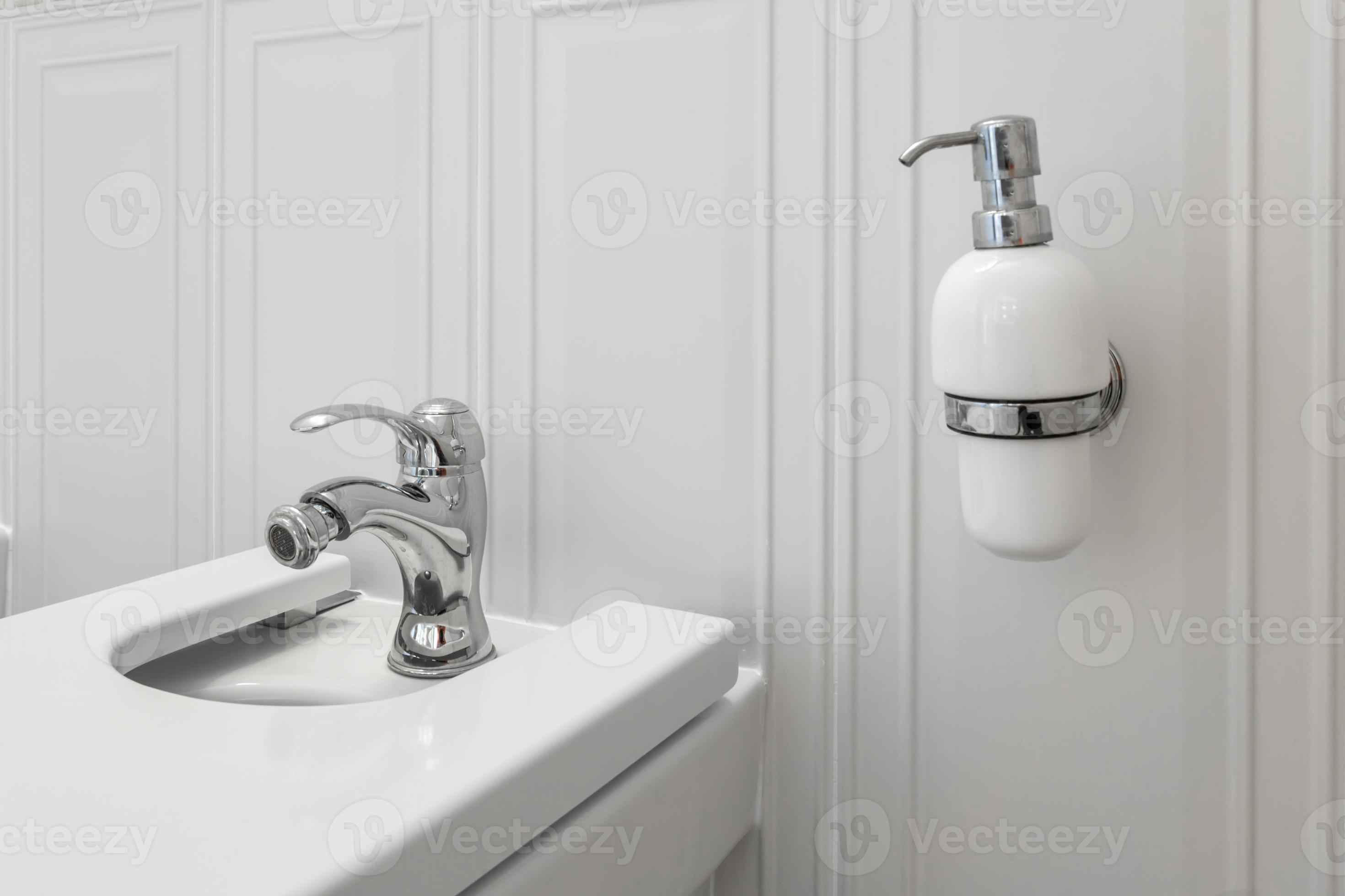 toilet and detail of a corner shower bidet with soap and shampoo