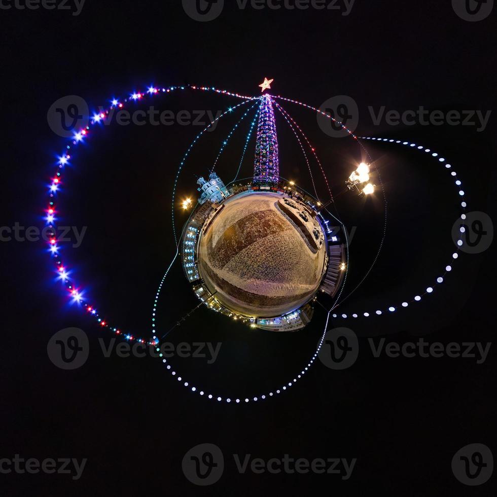 New year little planet.  Spherical aerial 360 degree panorama night view on a festive square with a Christmas tree photo