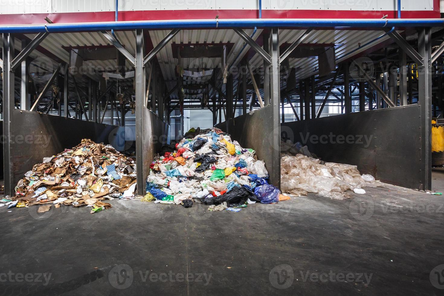 Separate garbage collection and waste sorting at the treatment processing plant. Recycling separate and storage of garbage for further disposal. Business for sorting and processing of trash. photo