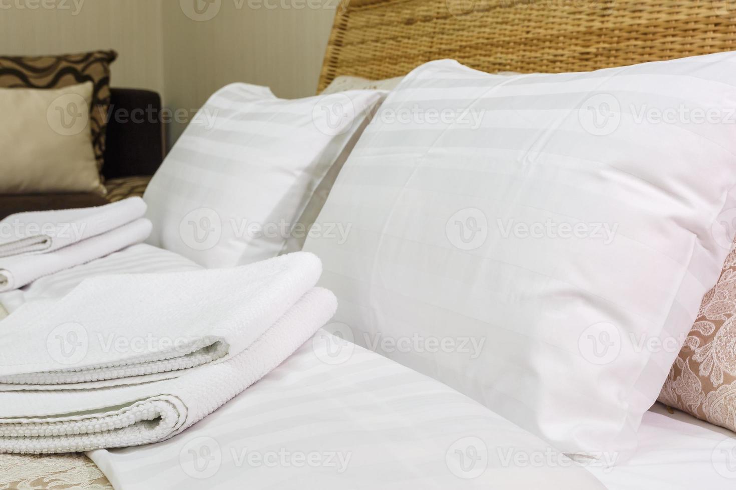 pillows on the bed in Interior of the modern bedroom in loft flat apartments in light color style photo