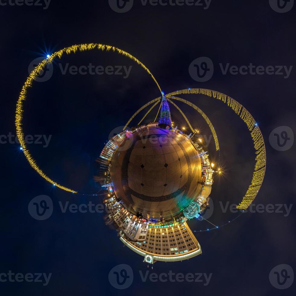 New year little planet.  Spherical aerial 360 degree panorama night view on a festive square with a Christmas tree photo