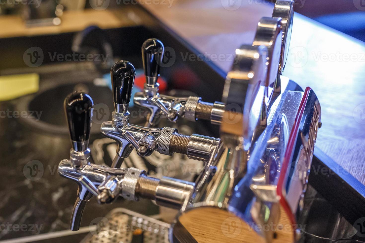 row of cranes for bottled craft beer and drinks in elite bar photo