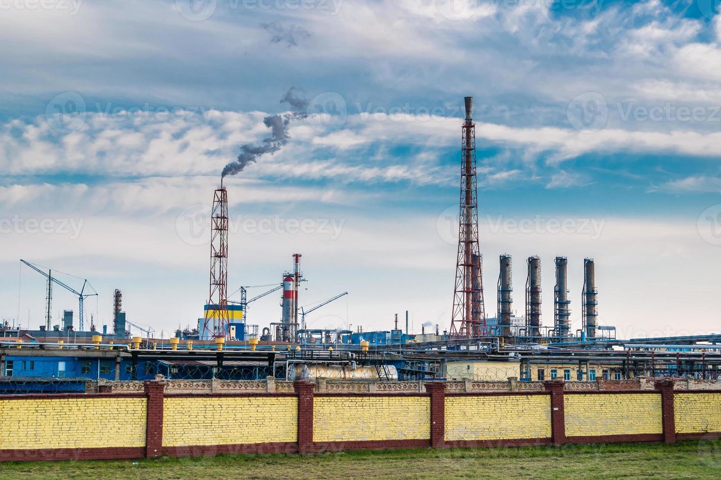 pipes of a chemical enterprise plant. Air pollution concept. Industrial landscape environmental pollution waste of thermal power plant photo