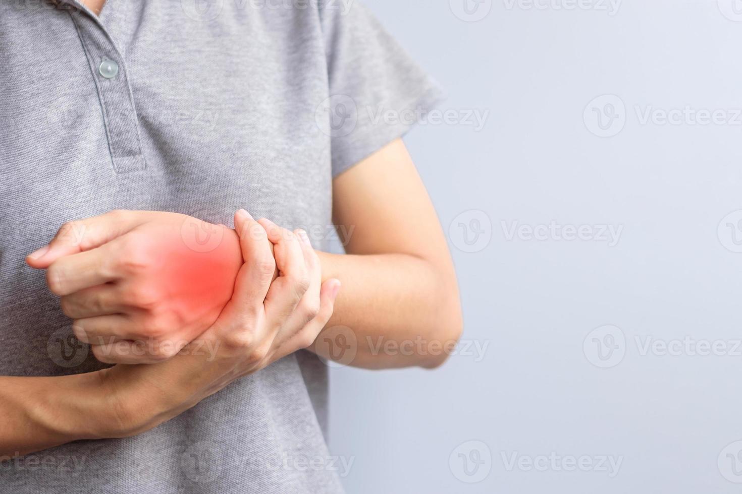 woman holding her wrist pain because using smartphone or computer long time. De Quervain s tenosynovitis, Intersection Symptom, Carpal Tunnel Syndrome or Office syndrome concept photo