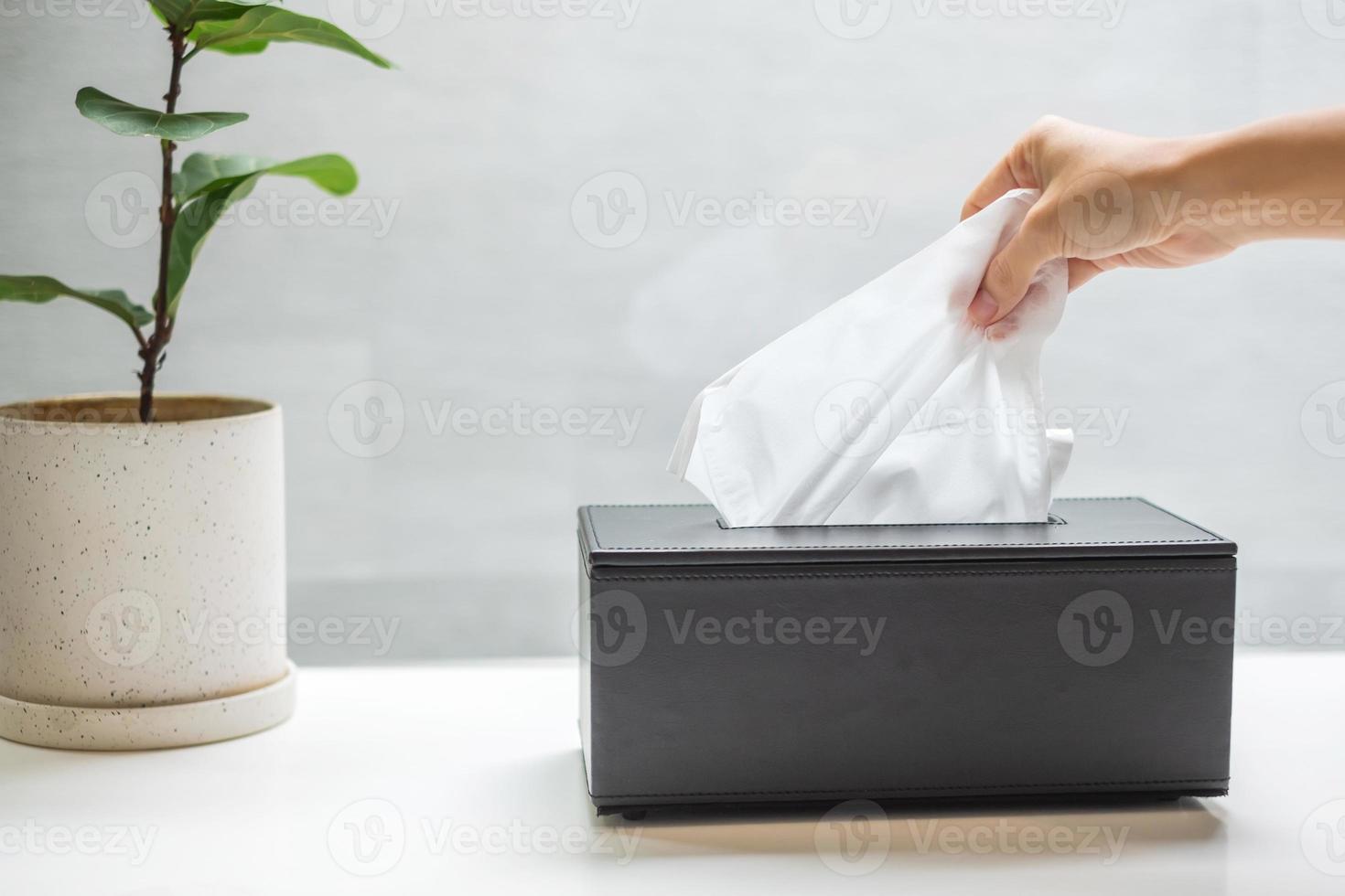 hand pulling toilet paper in bathroom. Cleaning, Lifestyle and personal hygiene concept photo