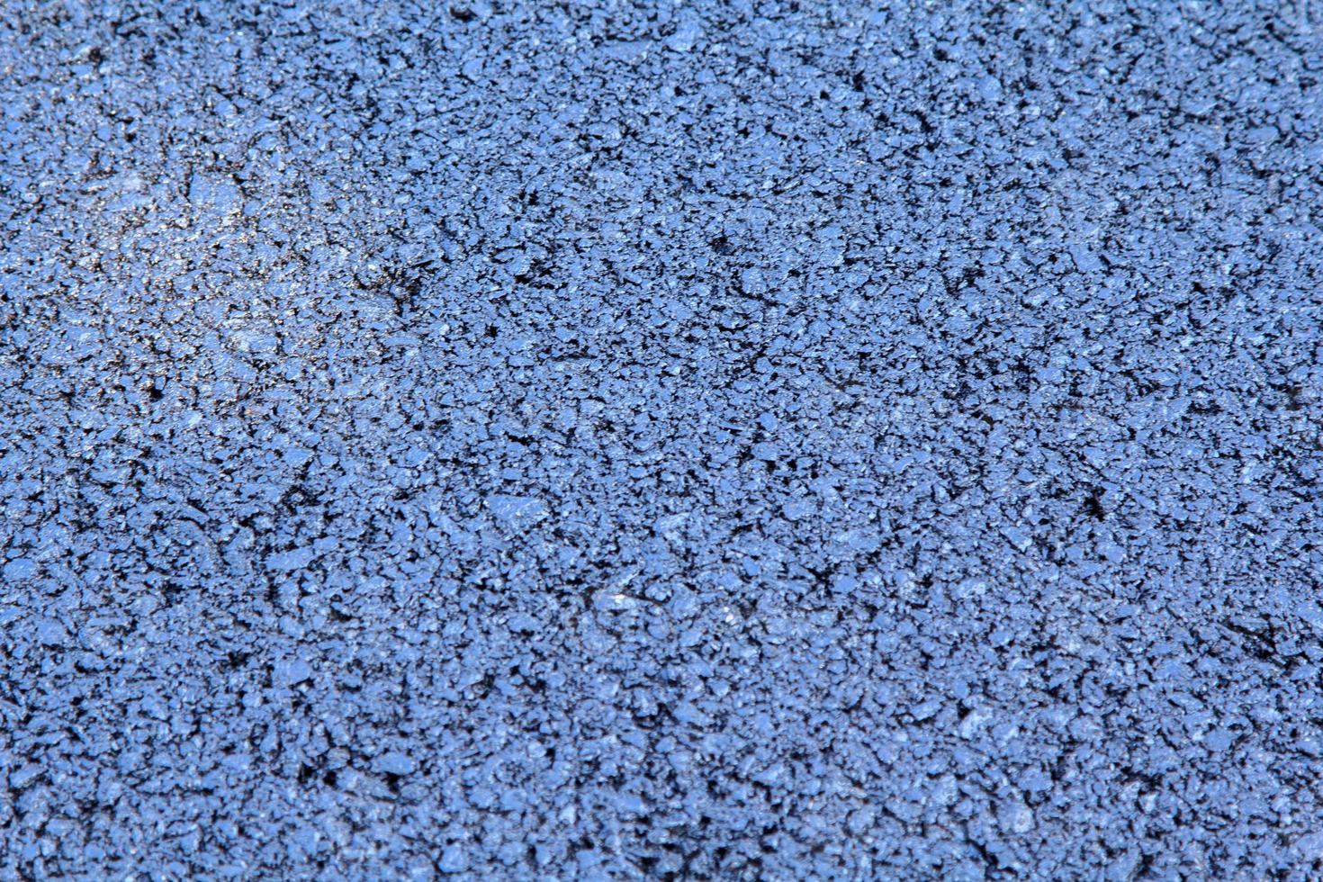 asphalt road surface under construction has gravel joints, with a black and gray background as a vertical and horizontal image. photo