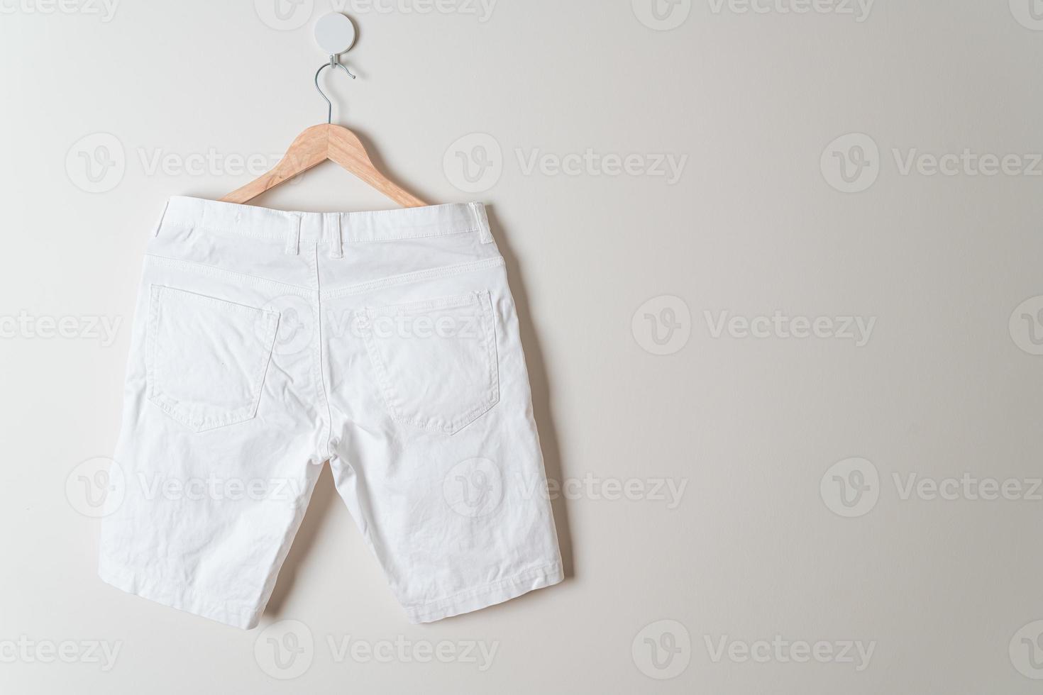 short pants hanging on wall photo