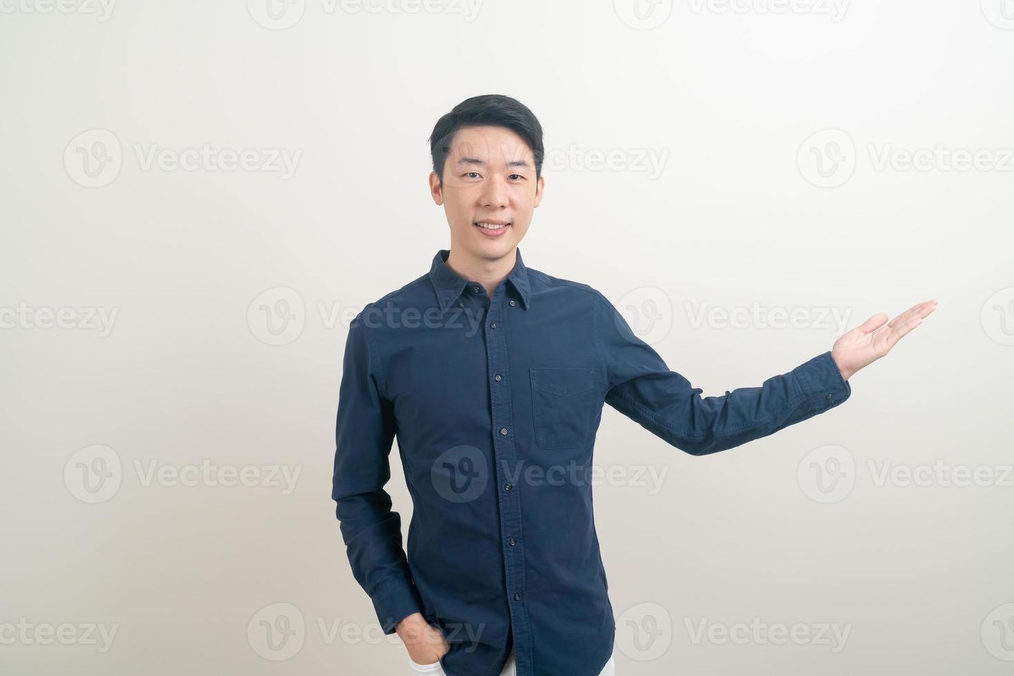 Asian man with hand pointing or presenting on white background photo