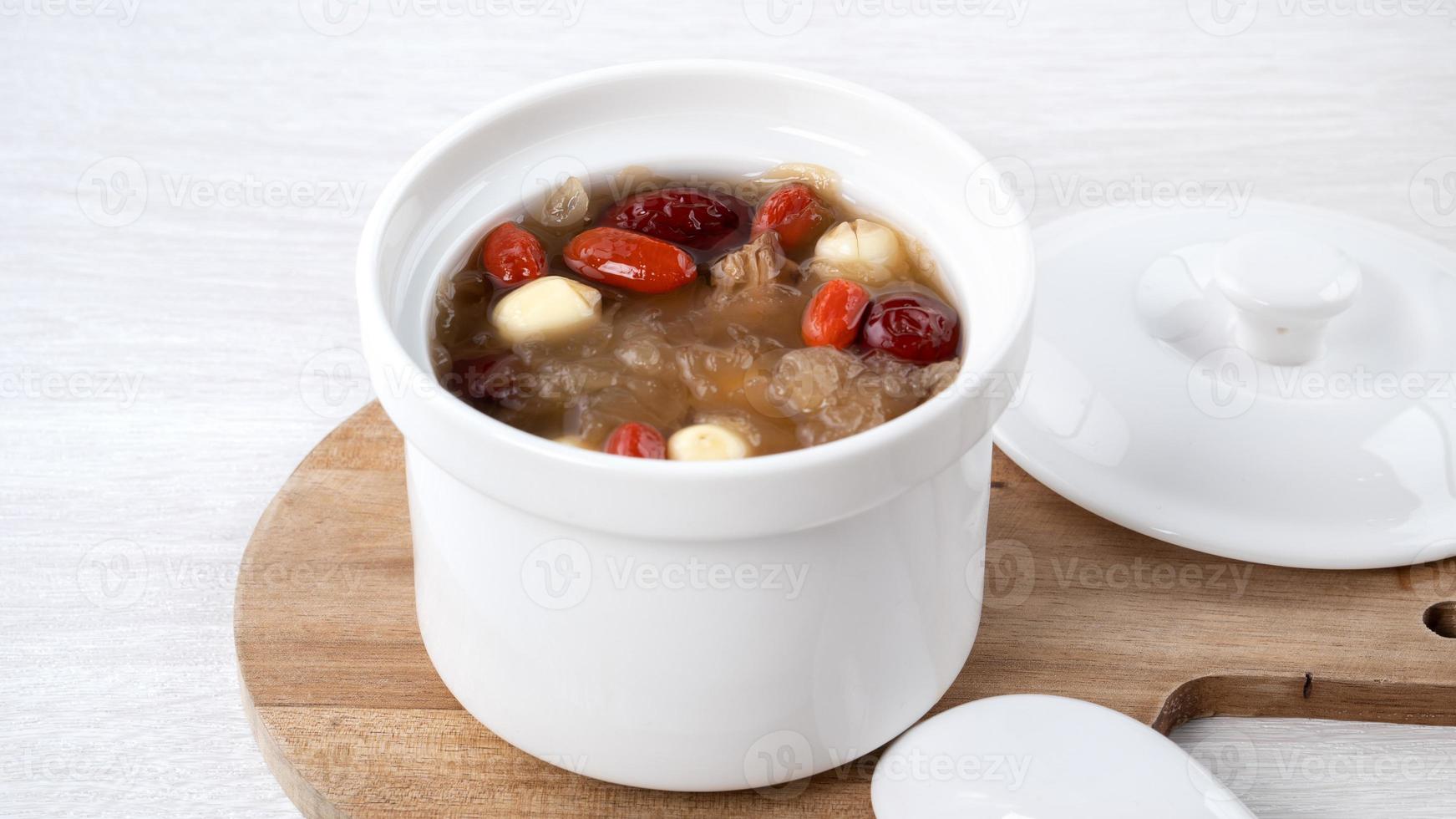 Close up of sweet snow white fungus soup with lotus seed, Chinese red dates and wolfberry. photo