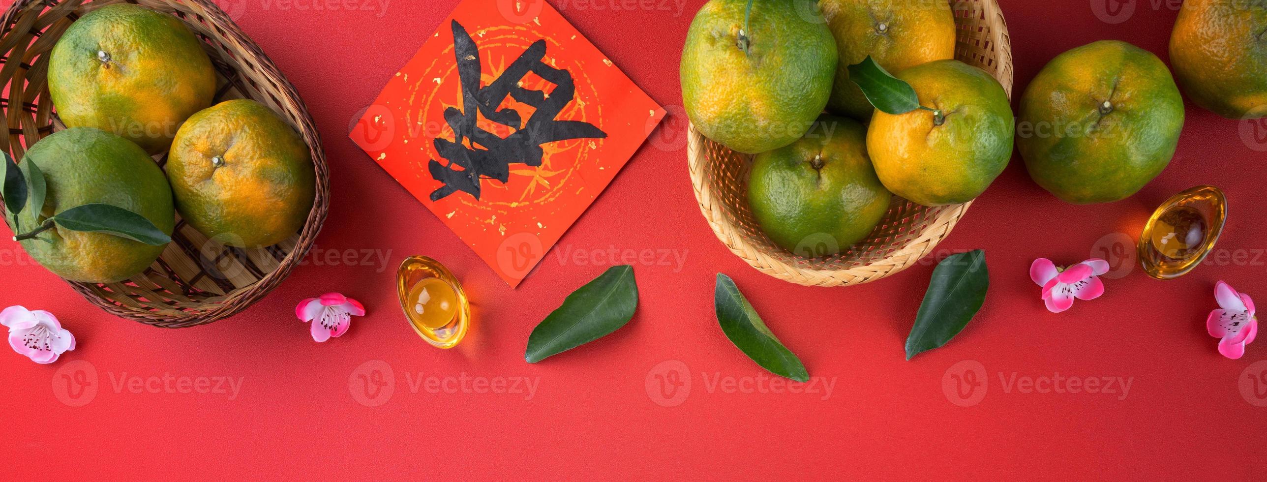 Top view of fresh tangerine mandarin orange on red background for Chinese lunar new year. photo