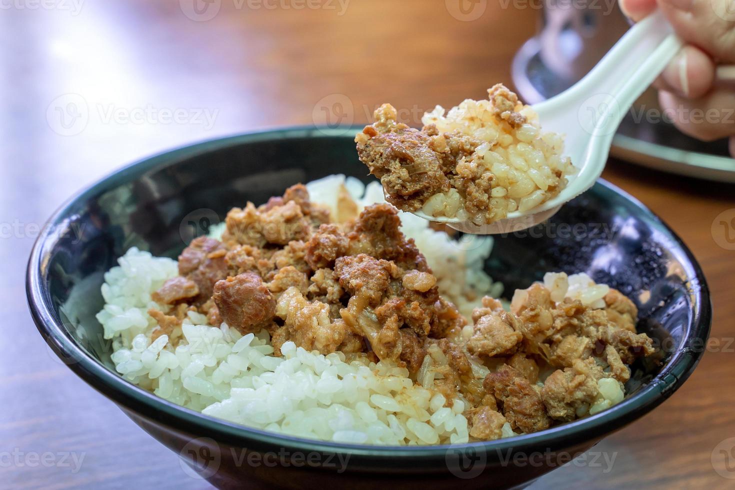 Braised meat over cooked rice, famous and delicious street food in Taiwan. photo