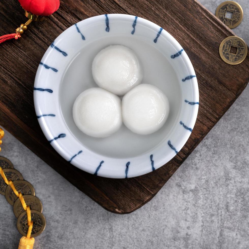 Top view of big tangyuan yuanxiao in a bowl on gray background for lunar new year food. photo