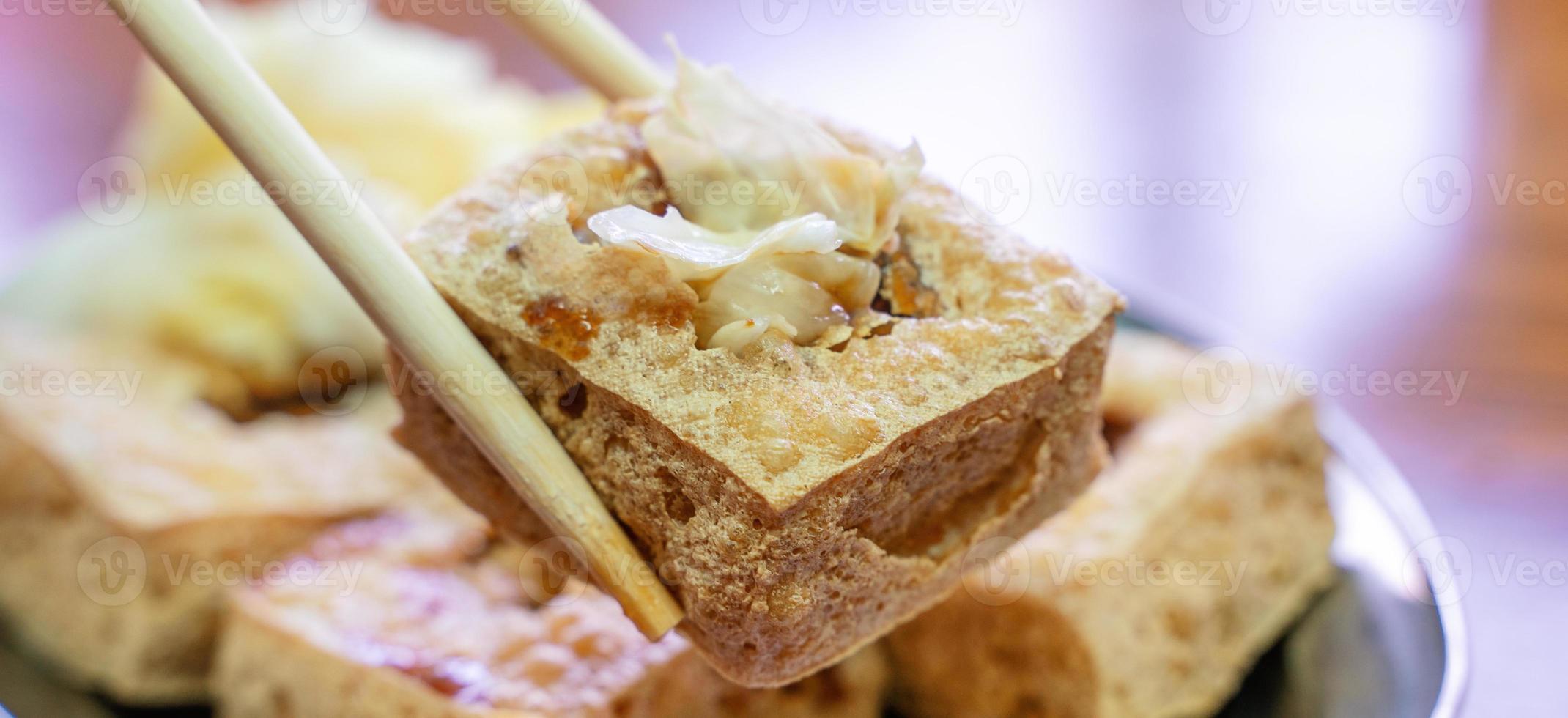 Deep fried stinky tofu with pickled cabbage, famous and delicious street food in Taiwan. photo