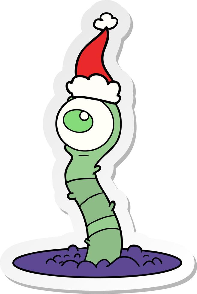 sticker cartoon of a alien swamp monster wearing santa hat vector