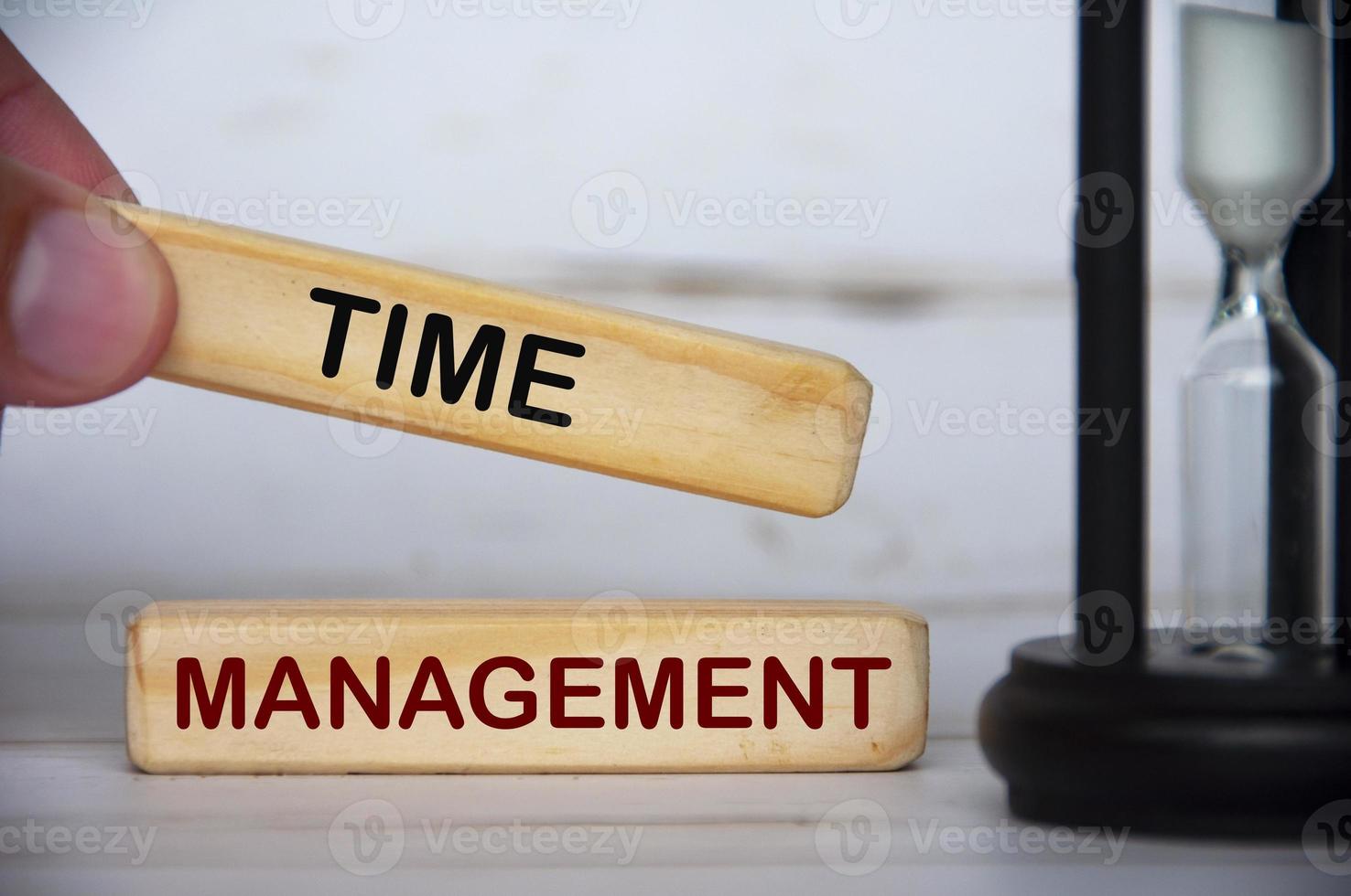 Hand holding wooden blocks with text - Time management. Time concept photo