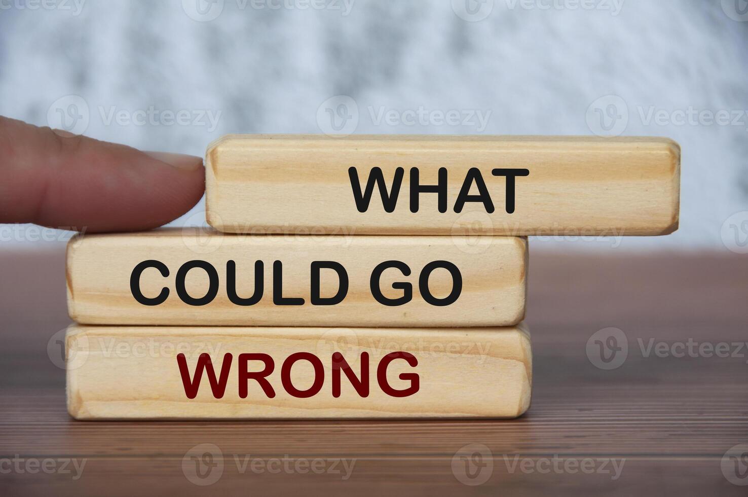 What could go wrong text on wooden blocks with blurred marble background. Fact finding concept photo