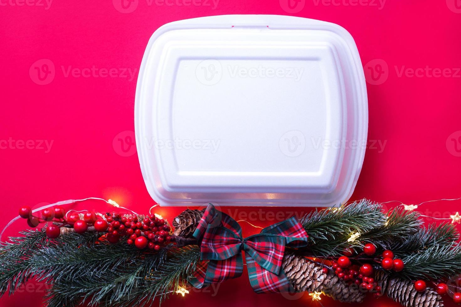 Christmas decor of food delivery service containers. New year's eve promotion. Ready-made hot order, disposable plastic and paper packaging. Work on public holidays catering. Copy space, mock up photo