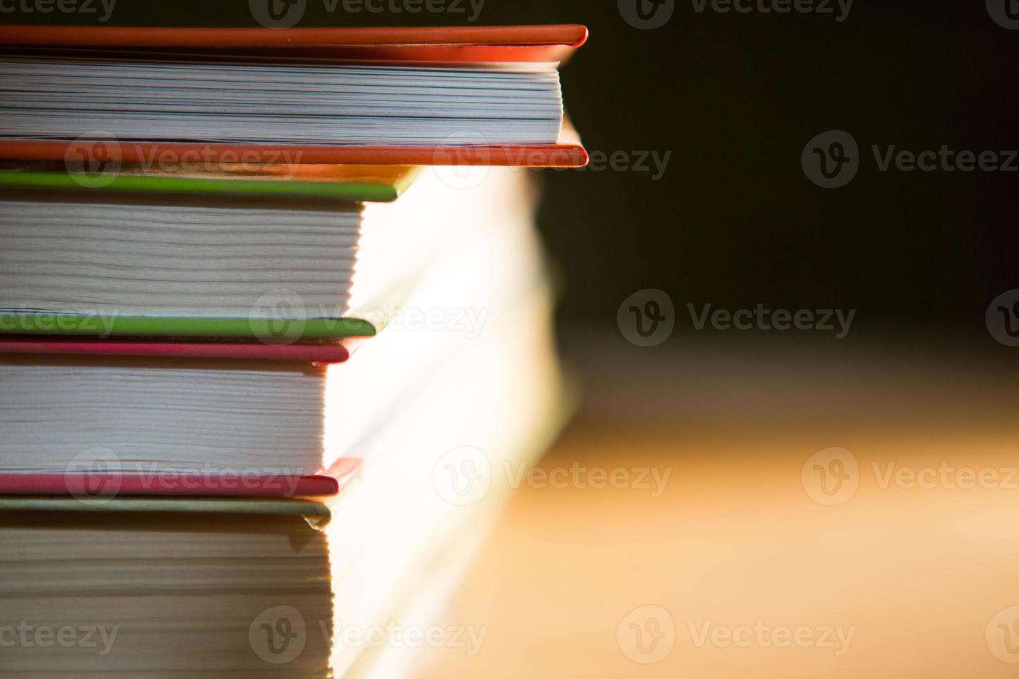 Close-up of a stack of books. The concept of home reading of paper books, school education and Institute, back to school. Space for text, background. photo