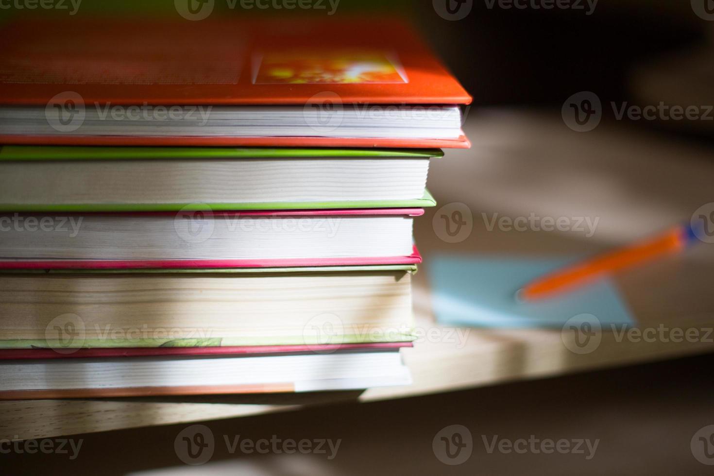 Close-up of a stack of books. The concept of home reading of paper books, school education and Institute, back to school. Space for text, background. photo