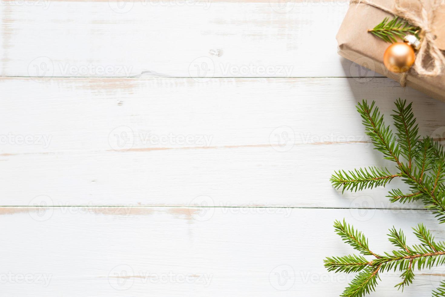 Gift box for Christmas and new year in eco-friendly materials kraft paper, live fir branches, cones, twine. Tags with mock up, natural decor, hand made, DIY. Flatly, background, frame, Minimalism photo