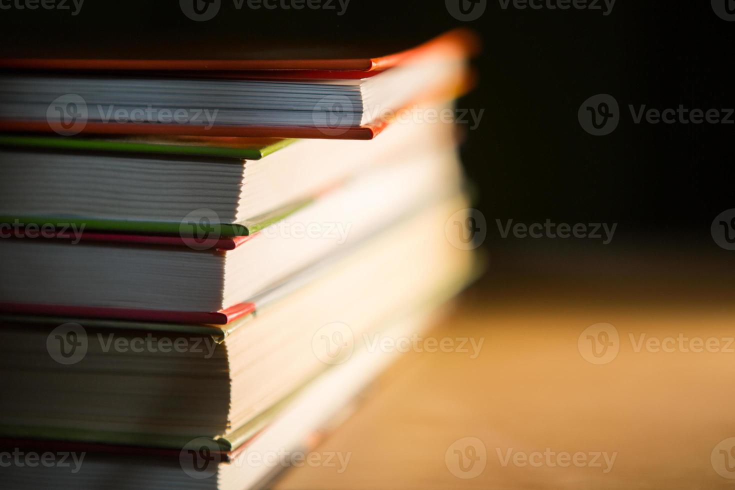 Close-up of a stack of books. The concept of home reading of paper books, school education and Institute, back to school. Space for text, background. photo