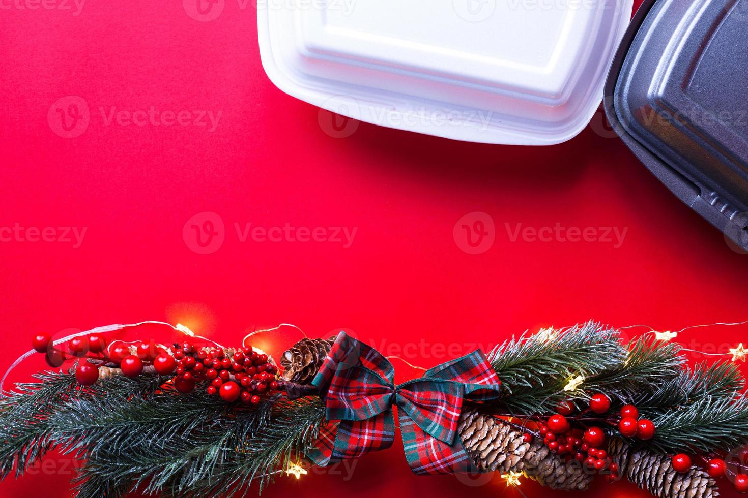 Christmas decor of food delivery service containers. New year's eve promotion. Ready-made hot order, disposable plastic and paper packaging. Work on public holidays catering. Copy space, mock up photo