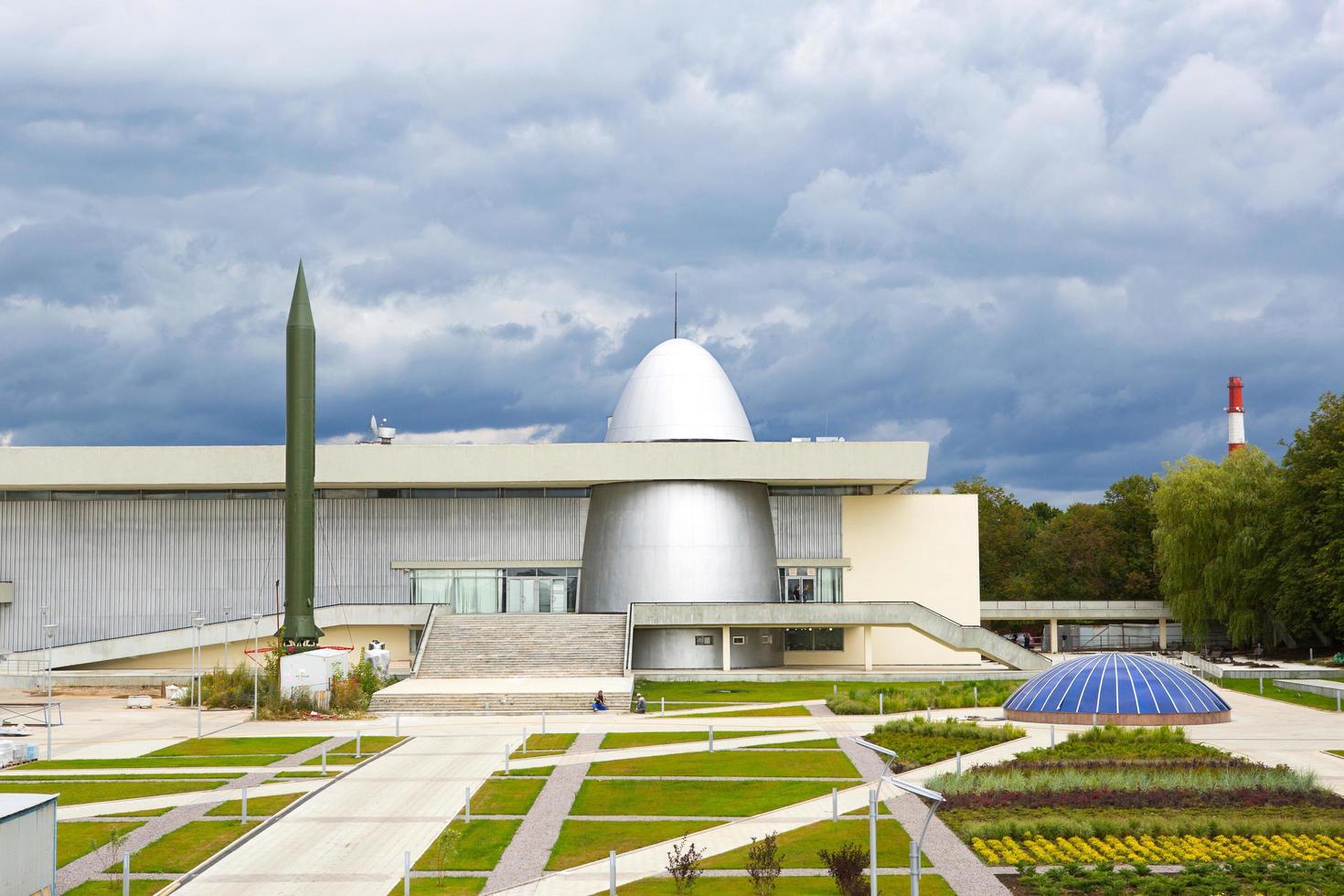 Russia, Kaluga, August 14, 2020. Kaluga Museum of Cosmonautics. Rocket, planetarium dome, park in front of the building, reconstruction, construction of the second line photo