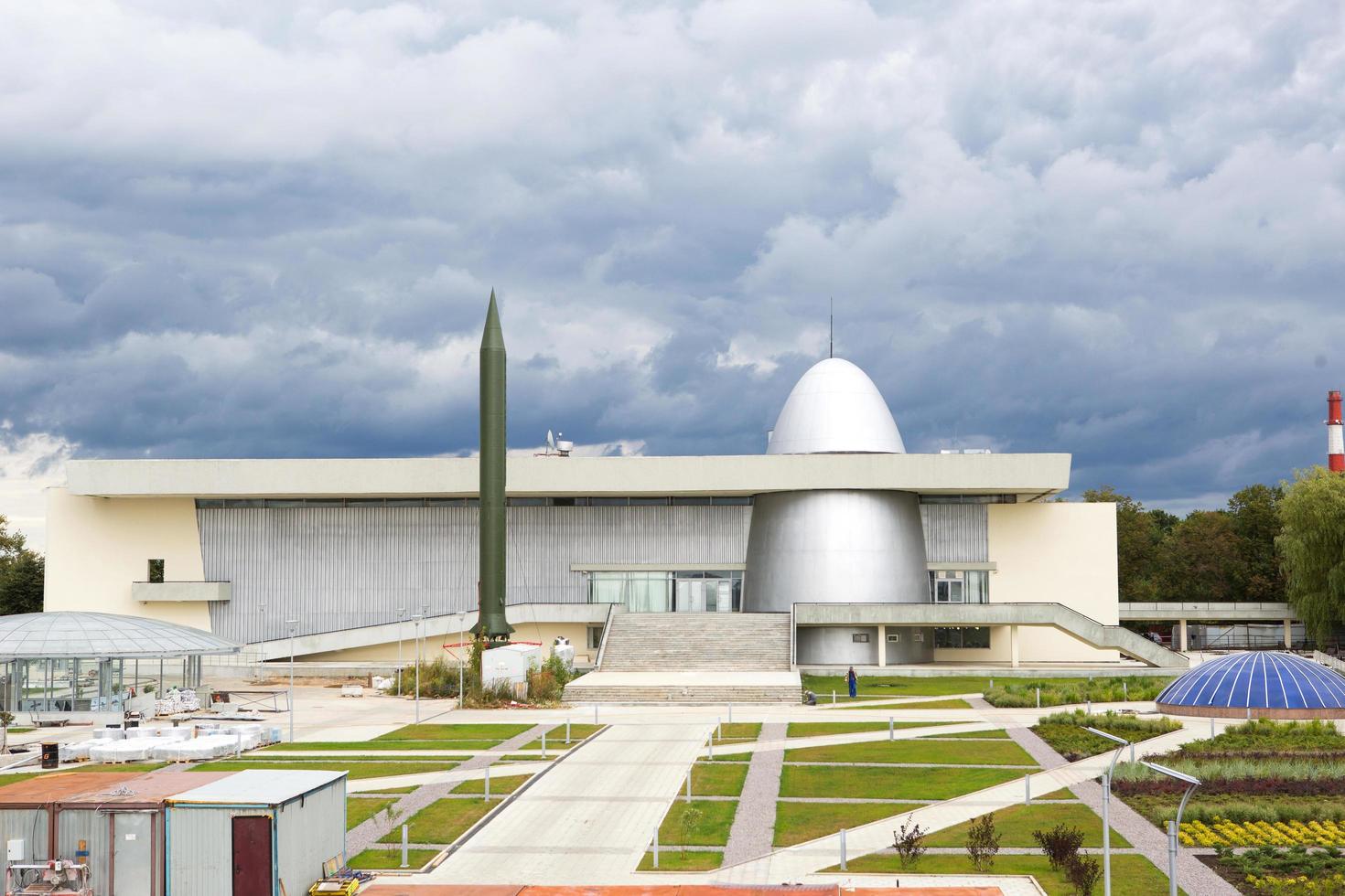 Russia, Kaluga, August 14, 2020. Kaluga Museum of Cosmonautics. Rocket, planetarium dome, park in front of the building, reconstruction, construction of the second line photo