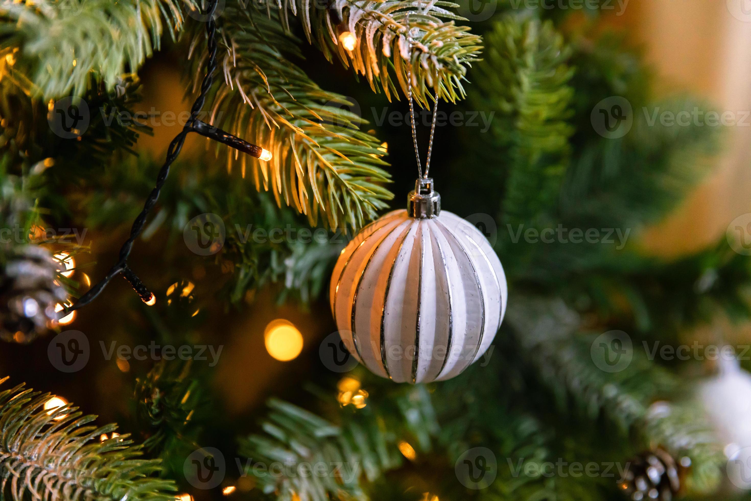 Classic Christmas decorated New year tree. Christmas tree with wite and silver  decorations, ornaments toy and ball. Modern classical style interior design  apartment. Christmas eve at home. 9972527 Stock Photo at Vecteezy