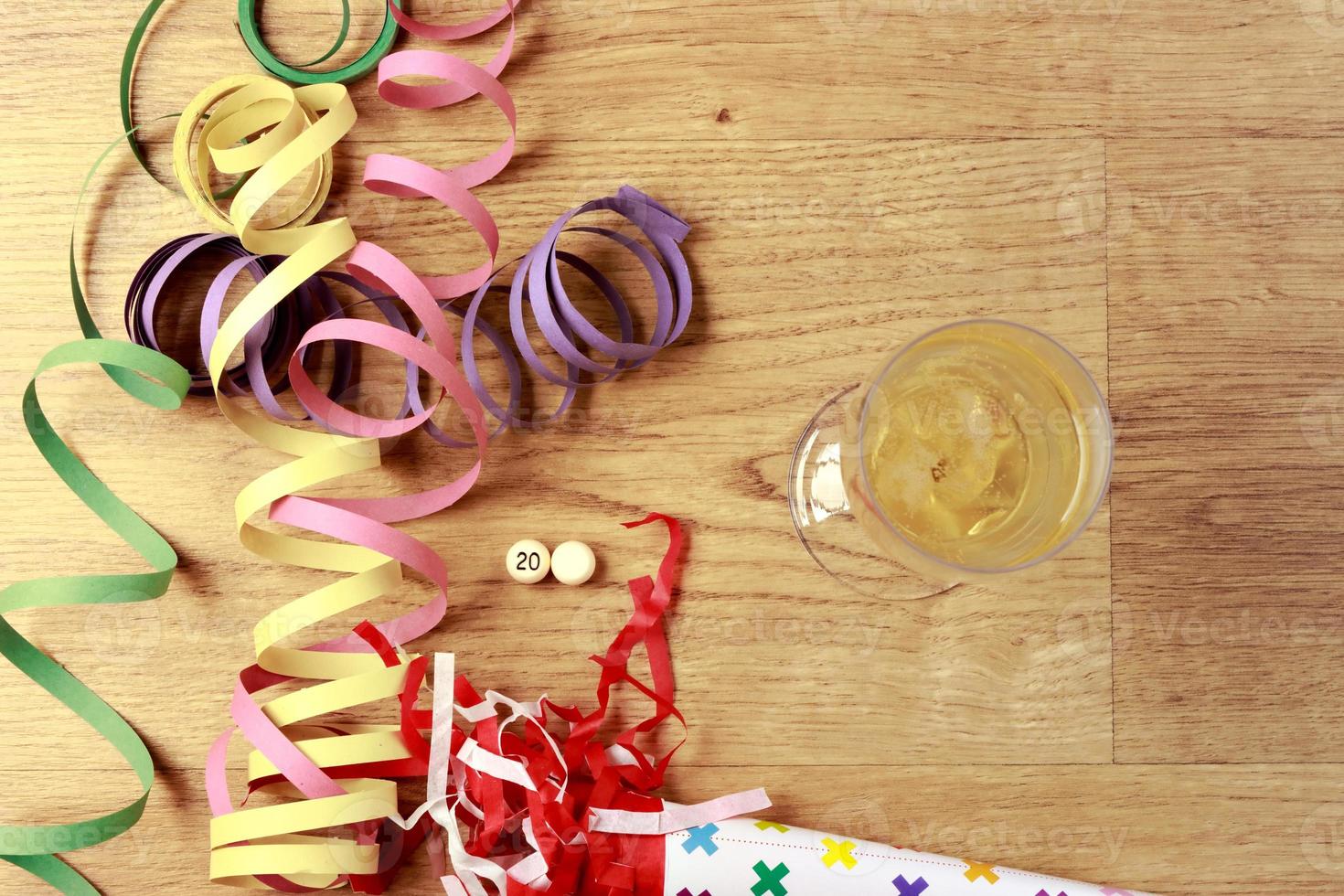 Party Decorations New Year's Eve with champagne on a parquet floor, with a white ball without a number, to put the year you want. Horizontal image. photo