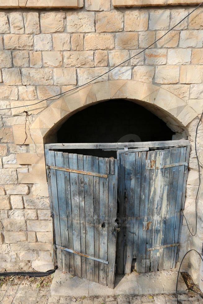 A door is an opening in a wall to enter and exit a building. photo