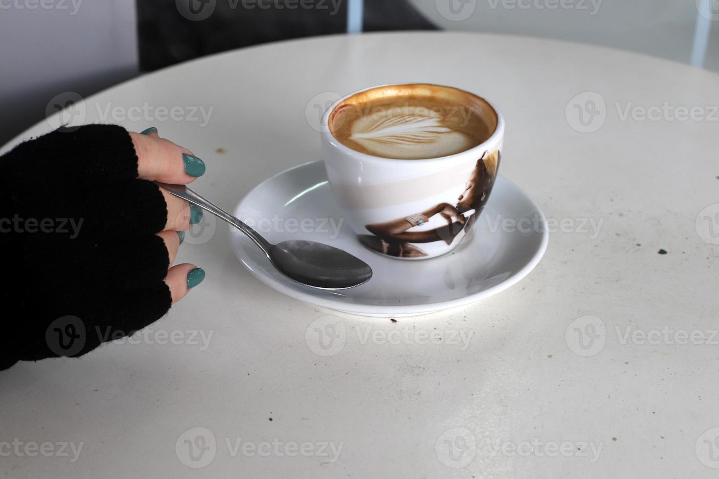 On the table in the restaurant strong and hot coffee. photo