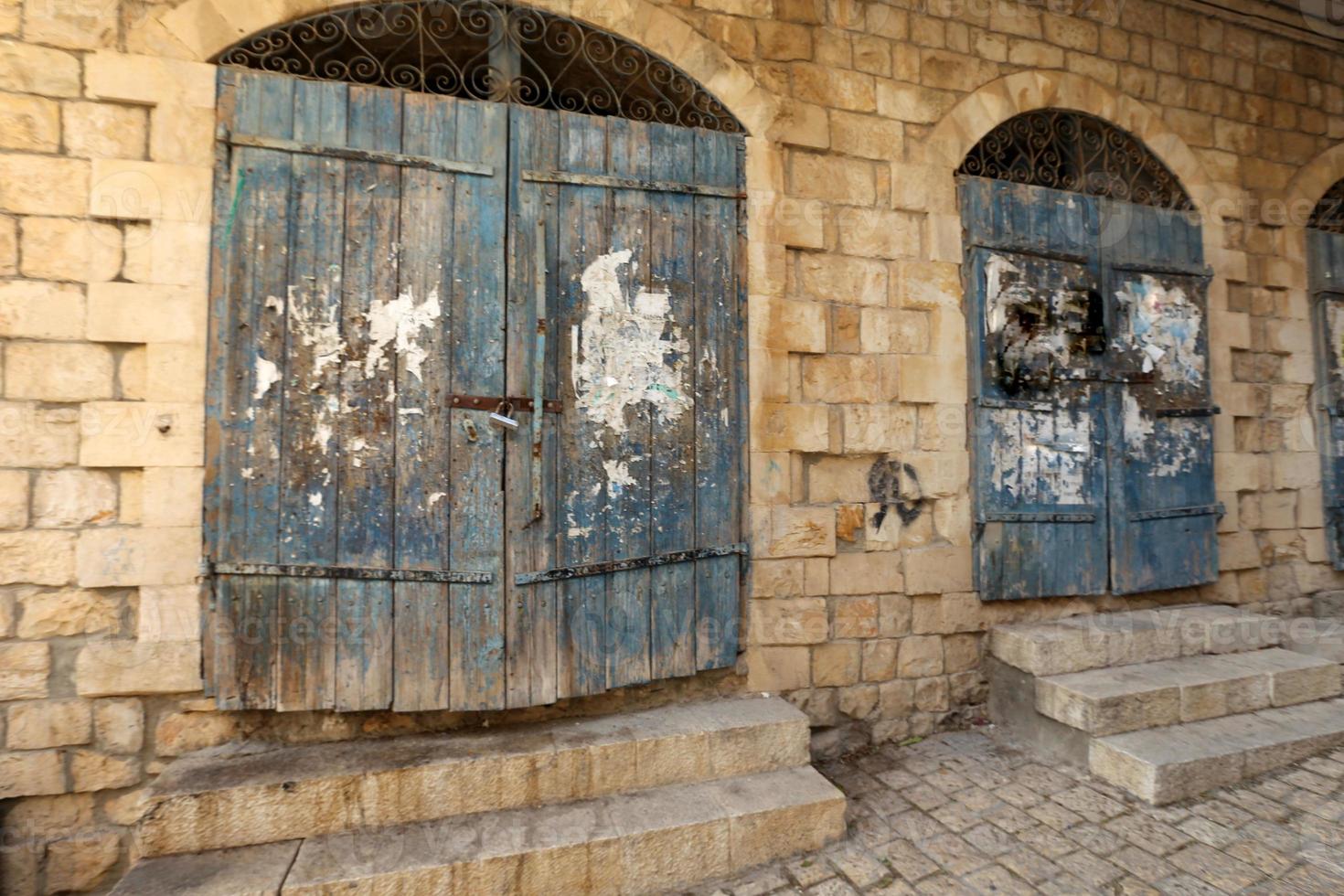 A door is an opening in a wall to enter and exit a building. photo