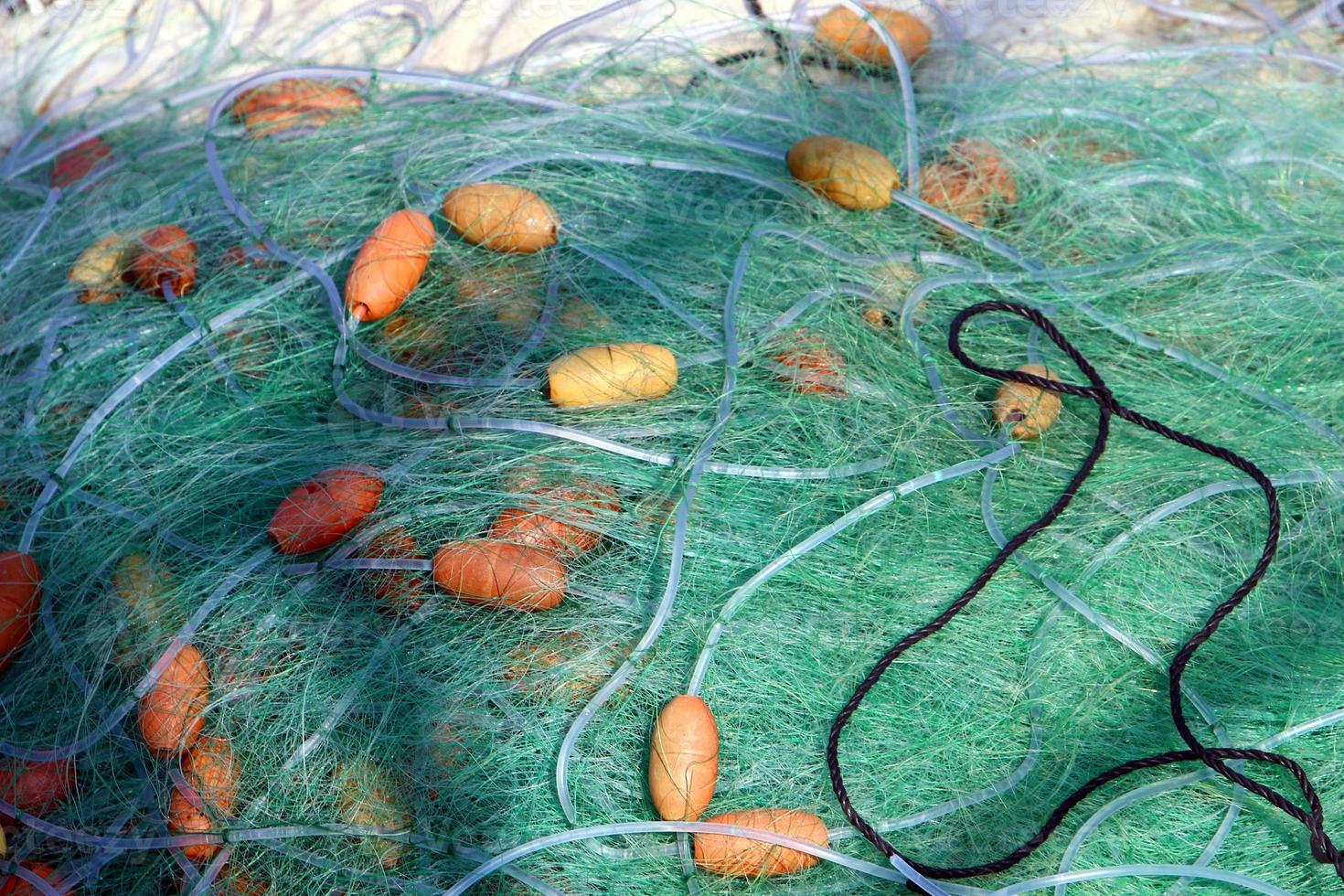 Fishing nets dry on the seashore. photo