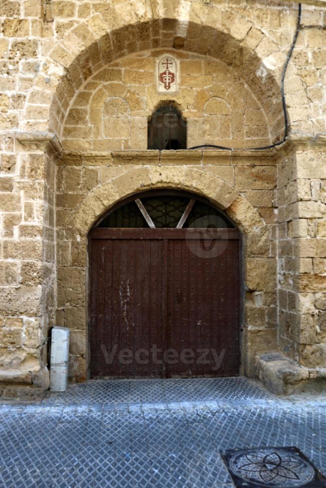 A door is an opening in a wall to enter and exit a building. photo