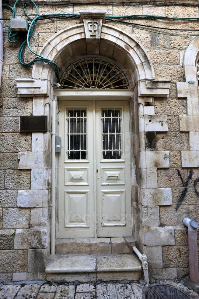 A door is an opening in a wall to enter and exit a building. photo