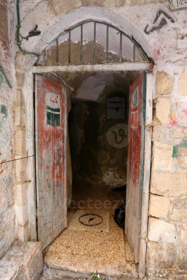 A door is an opening in a wall to enter and exit a building. photo