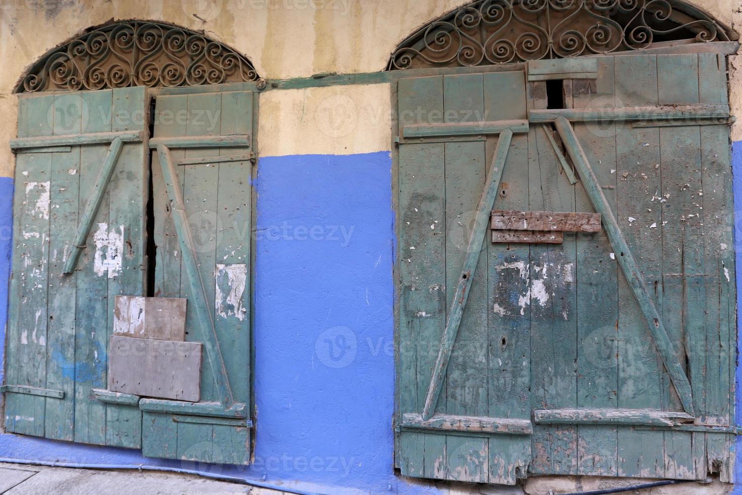 A door is an opening in a wall to enter and exit a building. photo