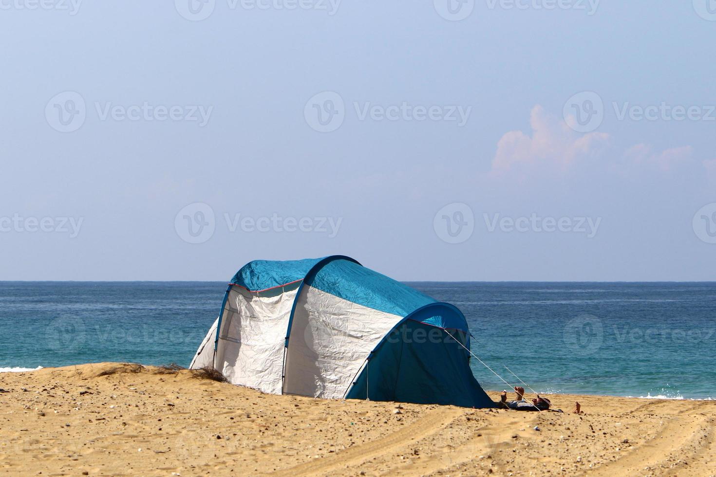 Tent for rest on the shores of the Mediterranean Sea. photo