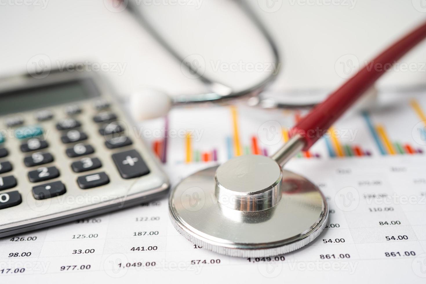 Stethoscope on charts and graphs paper, Finance, Account, Statistics, Investment, Analytic research data economy and Business company concept. photo