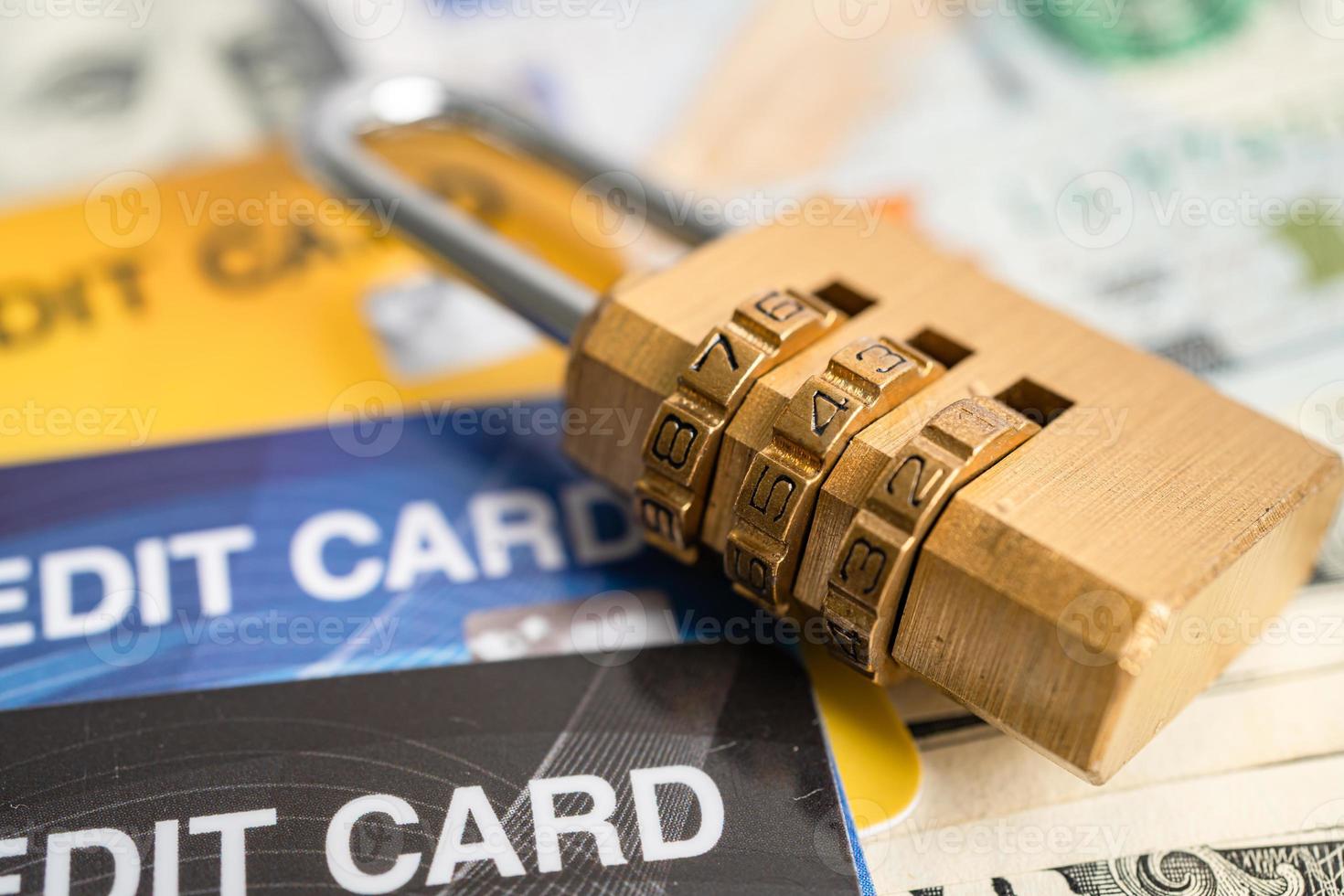 Credit card with password key lock security on US dollar background. photo