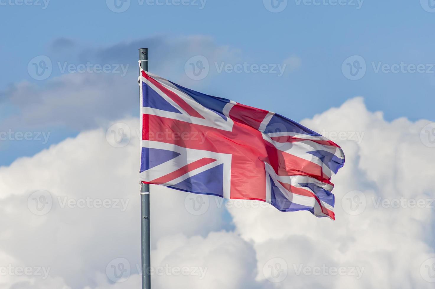 The National flag of United Kingdom flay over the blue sky photo