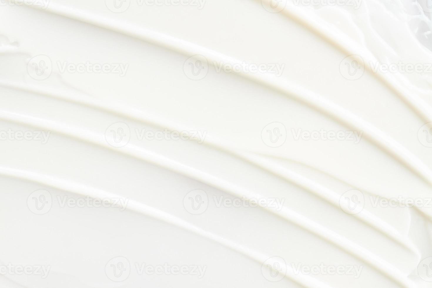 White cosmetic cream texture. Beauty balm, lotion, skincare background. Strokes of cream photo