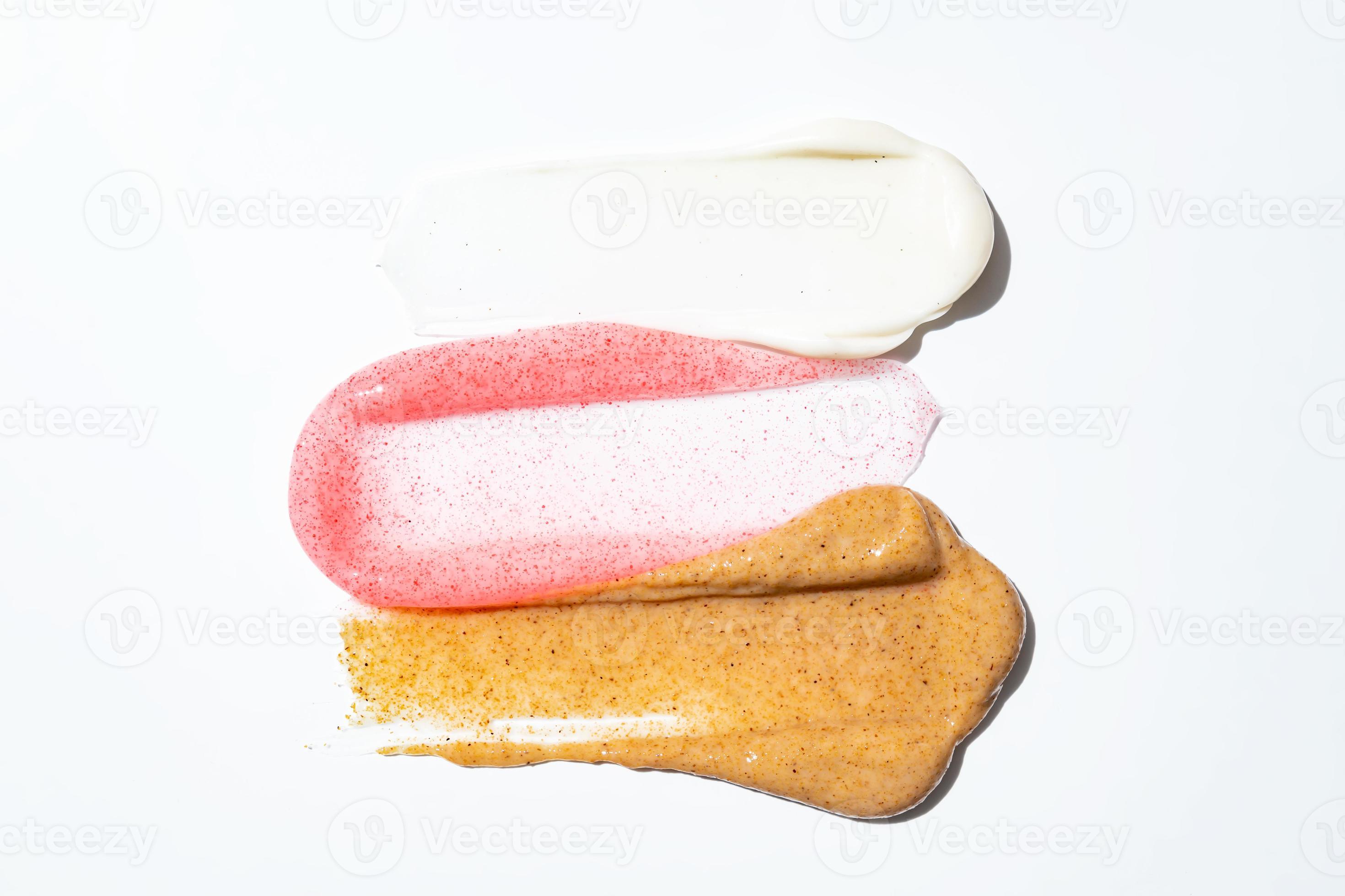 Face scrub creamy texture. White, pink and brown natural cosmetic