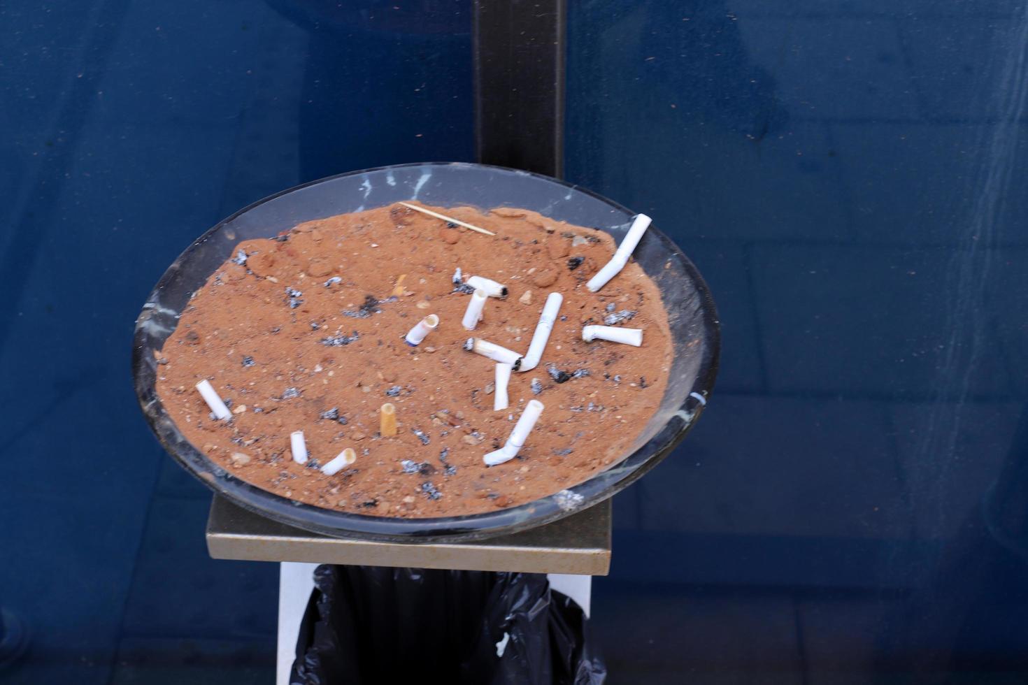 Ashtray - a place for tobacco ash and cigarette butts photo