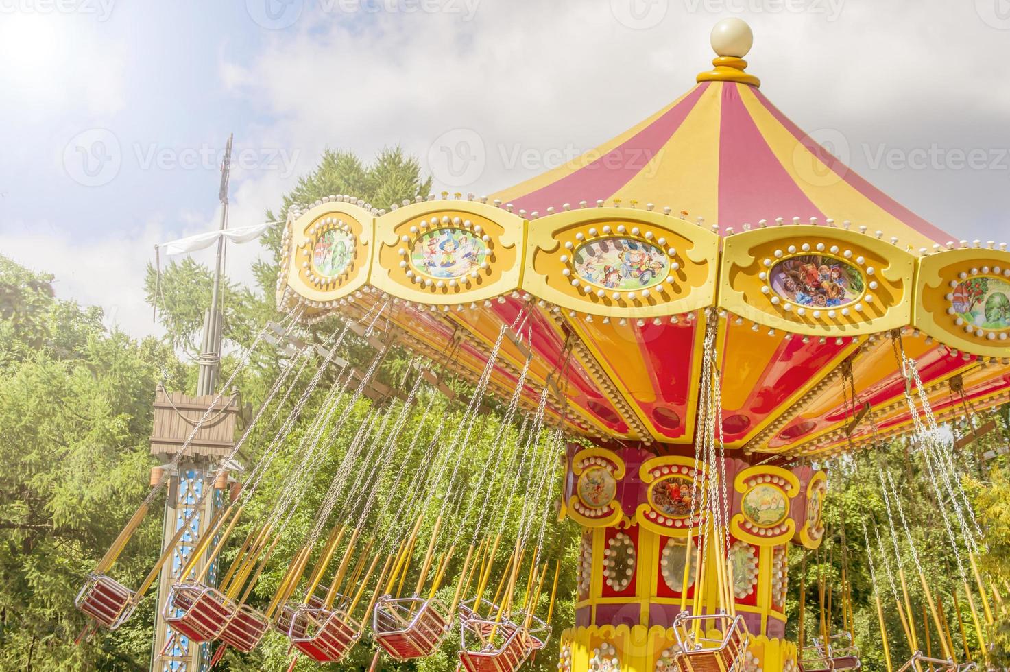 Colourful carousel in the Park. toned photo