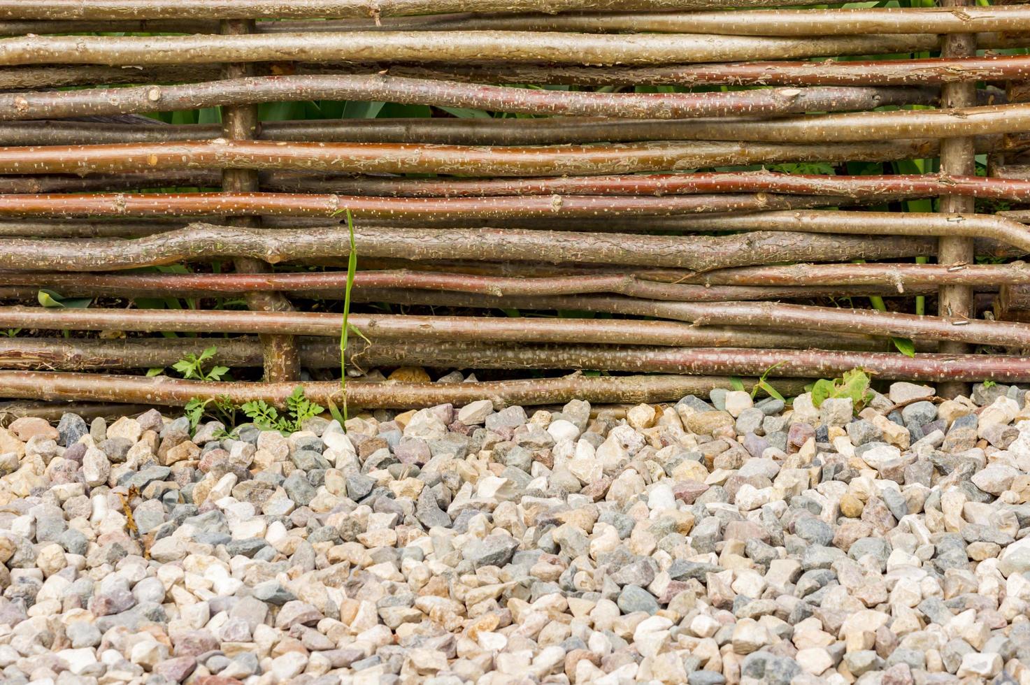 wooden fence and road made of stones photo