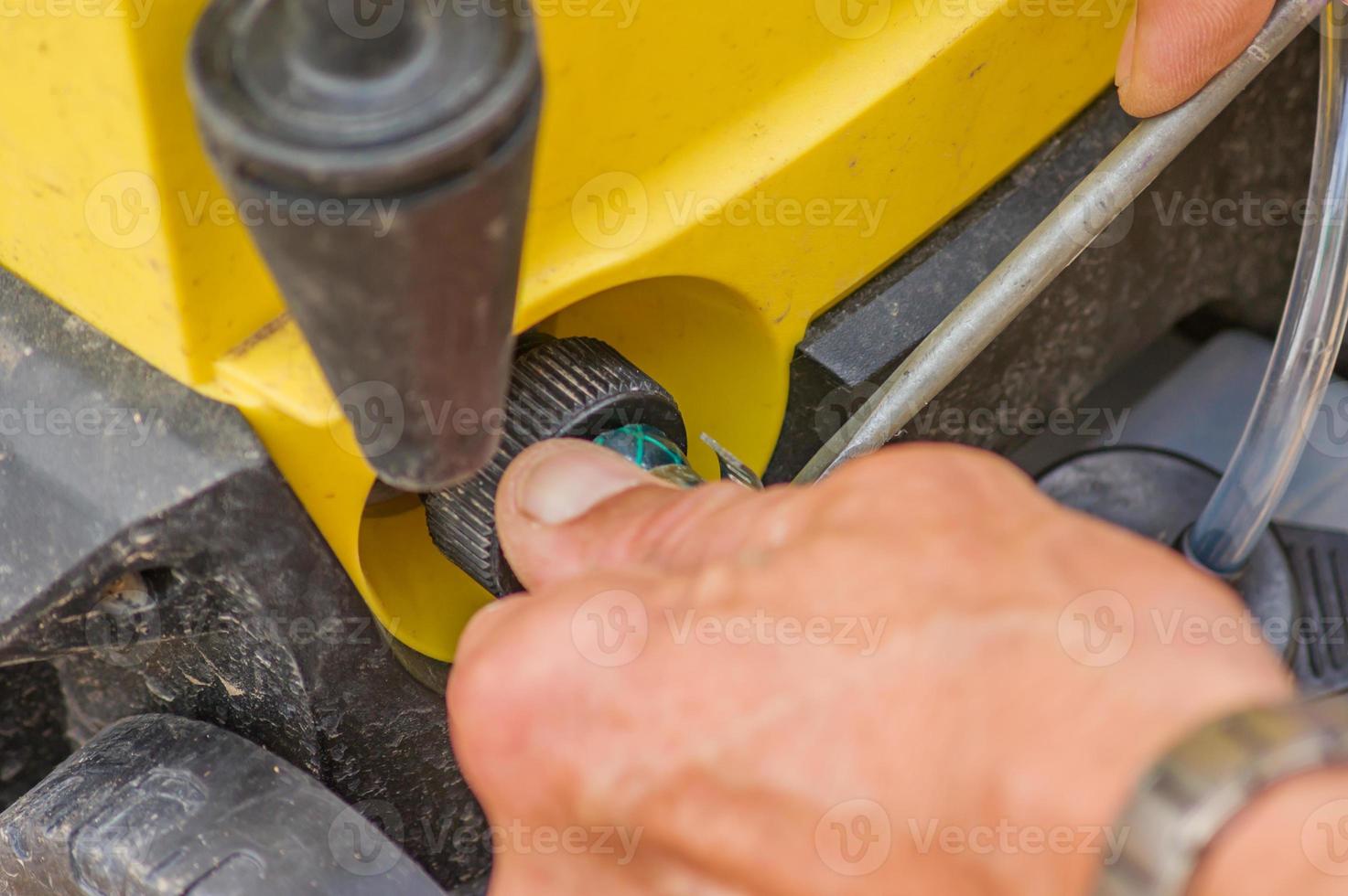 Hands of male fixing device photo