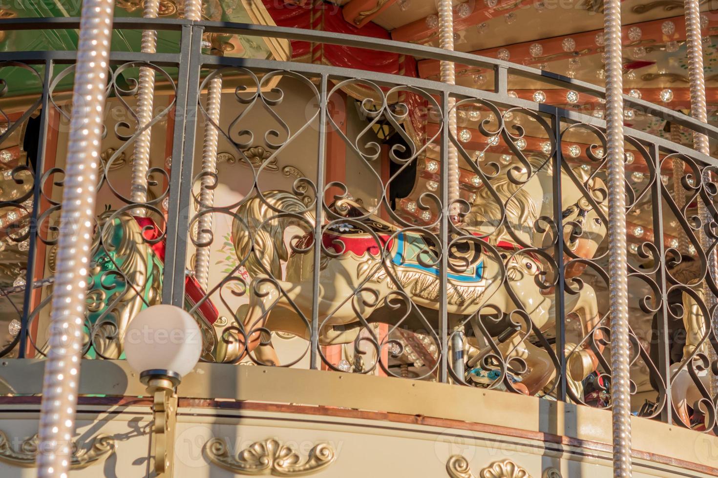 Horses on a upper level of carnival Merry-Go-Round. photo