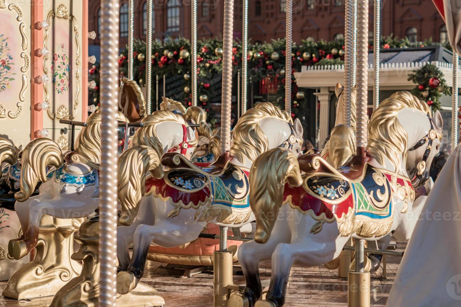 Horses of carnival Merry-Go-Round. photo